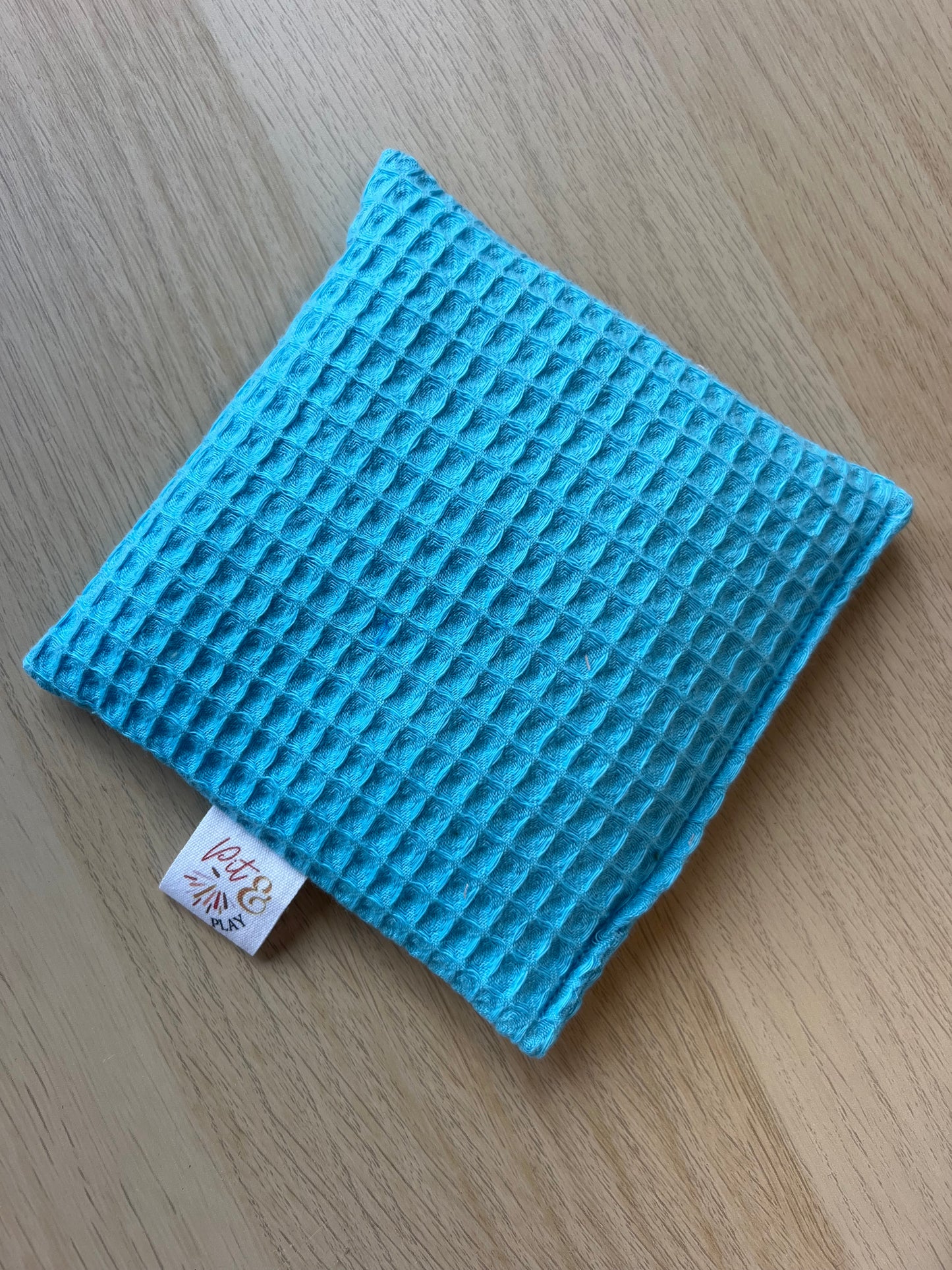 Wafelstof katoen pittenzakje aqua blauw